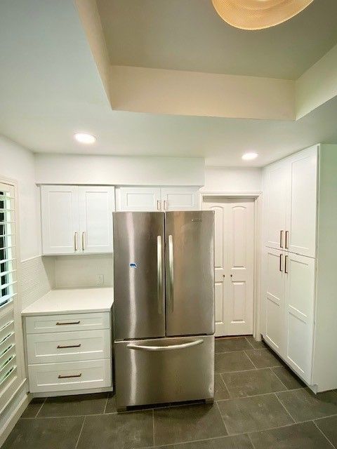 Home in the north Austin, TX with full kitchen remodel including new cabinets, new countertops, new backsplash, and whole house interior painting completed by Austin Painting and Cabinets