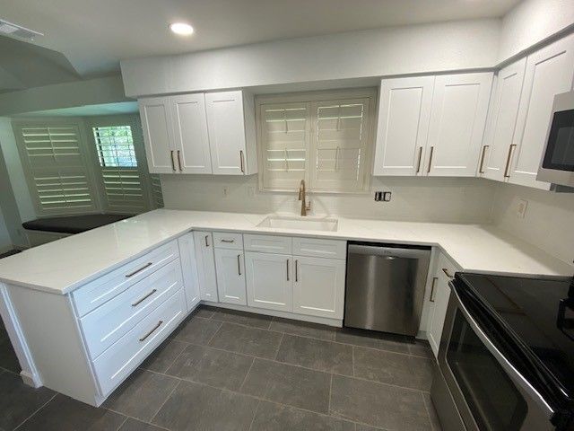 Home in the north Austin, TX with full kitchen remodel including new cabinets, new countertops, new backsplash, and whole house interior painting completed by Austin Painting and Cabinets
