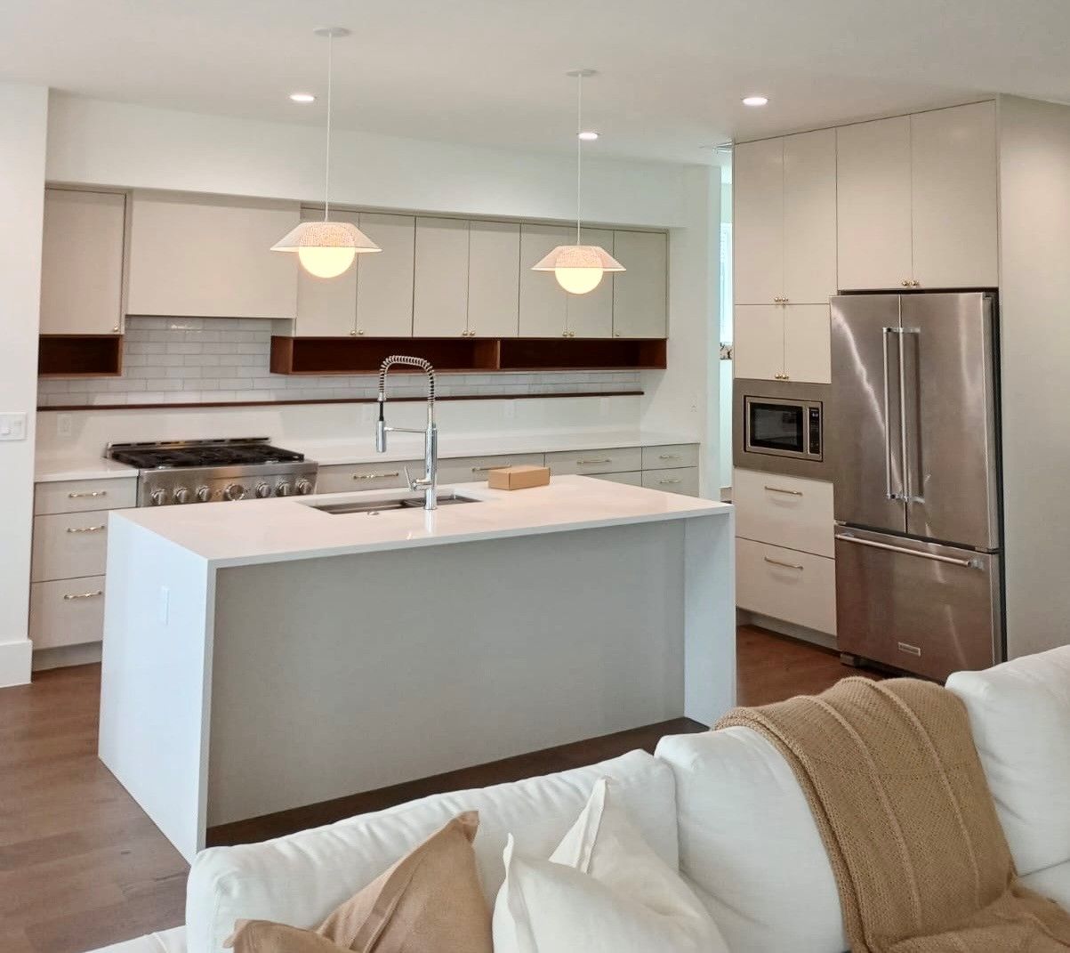 Home in the downtown Austin, TX with full kitchen remodel including cabinet painting, new countertops, and new backsplash completed by Austin Painting and Cabinets