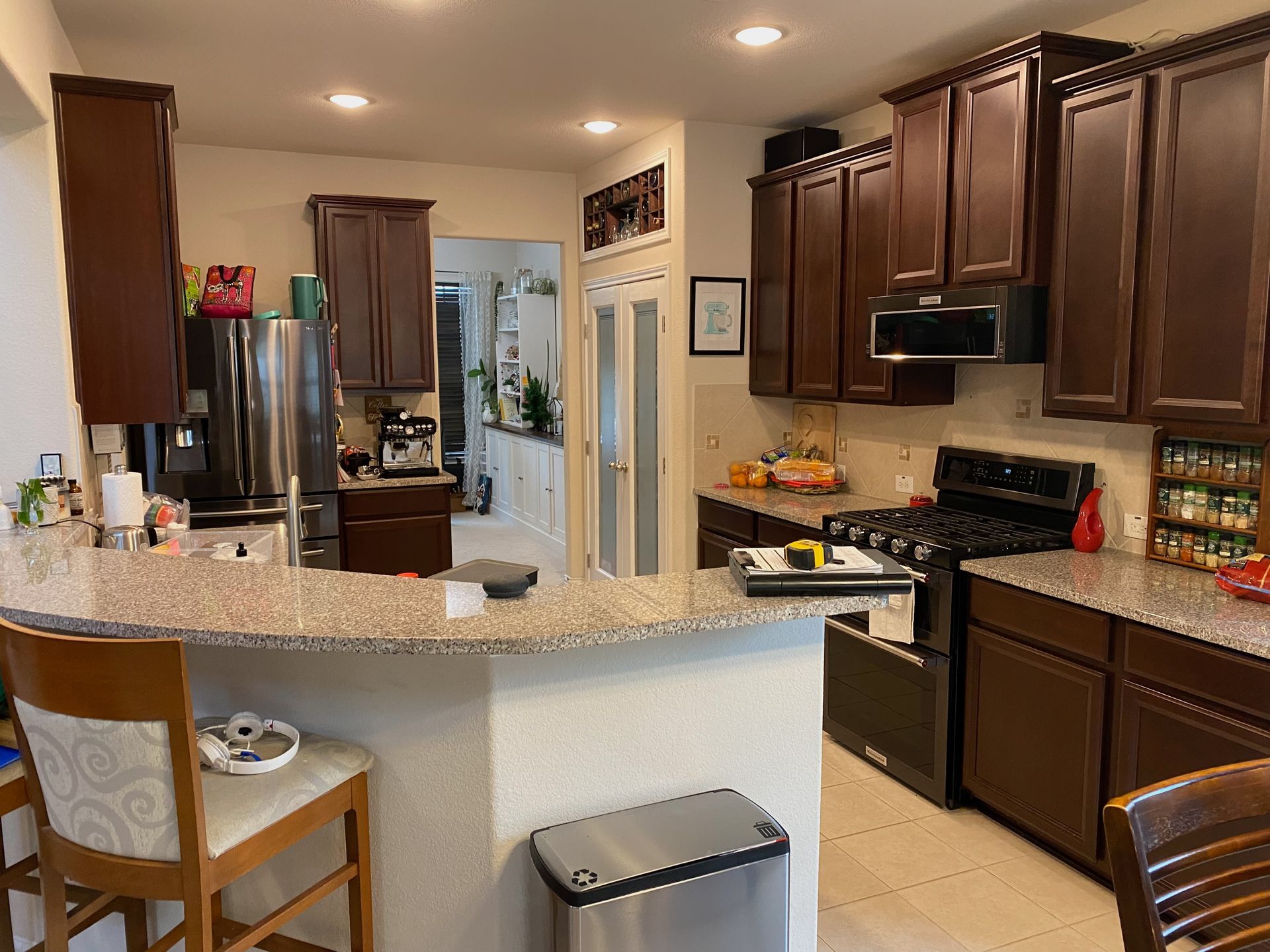 Oak Hill Austin kitchen before remodel with raised bar top and dated cabinets