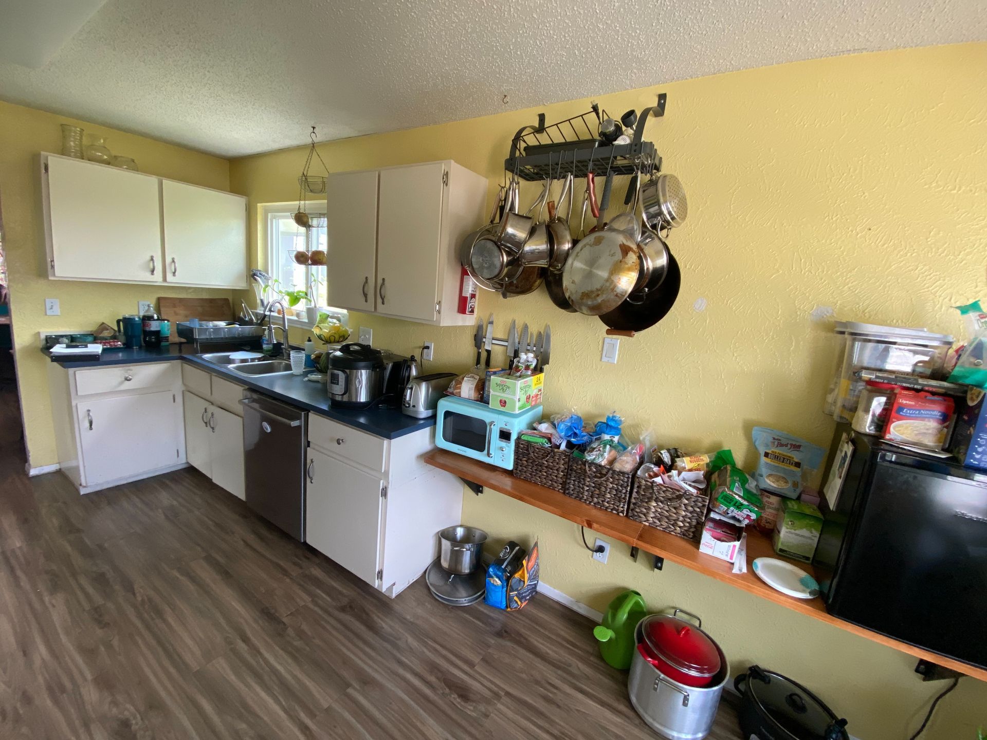 North Austin kitchen before remodel with outdated cabinets and popcorn ceiling