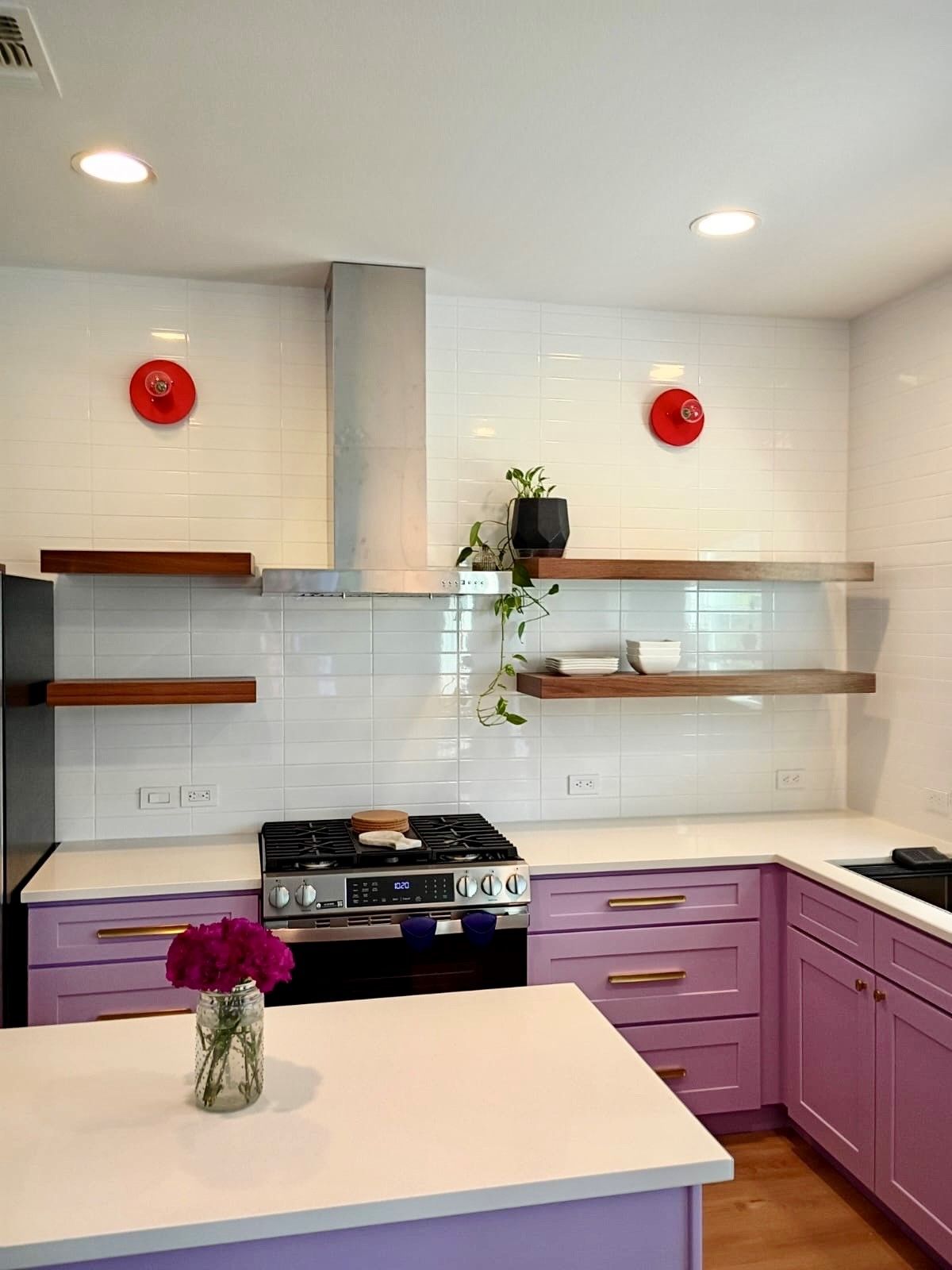 kitchen remodel in north austin including new cabinets painted a custom color, new countertops, new backsplash, new lighting