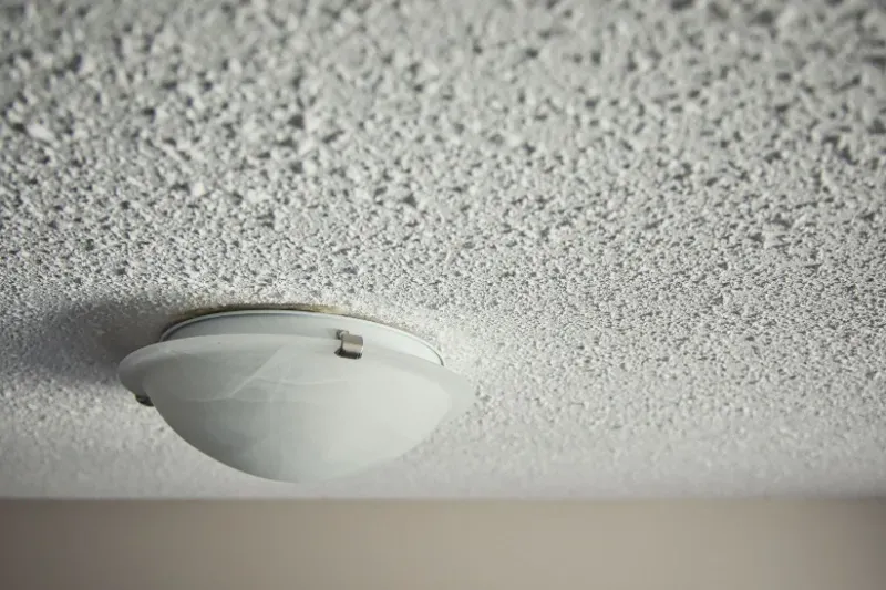 Popcorn ceiling in home in Round Rock, TX where homeowner has hired Austin Painting and Cabinets to do popcorn ceiling removal