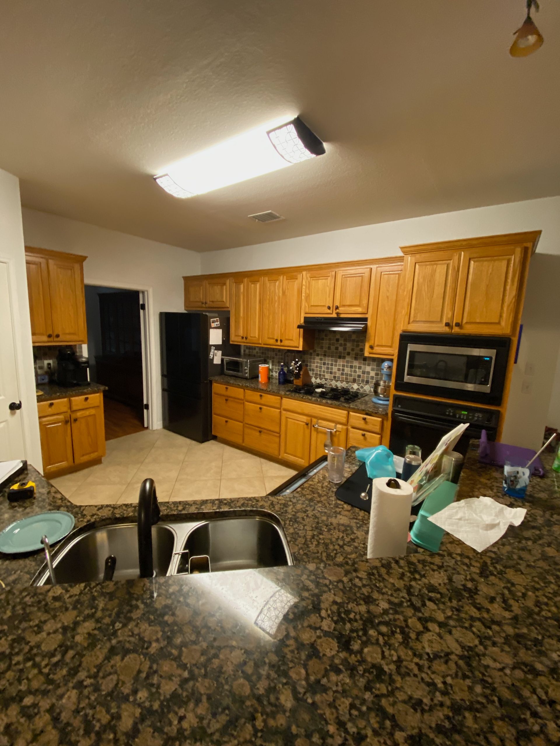 Austin kitchen before cabinet painting quartz countertops and lighting upgrades