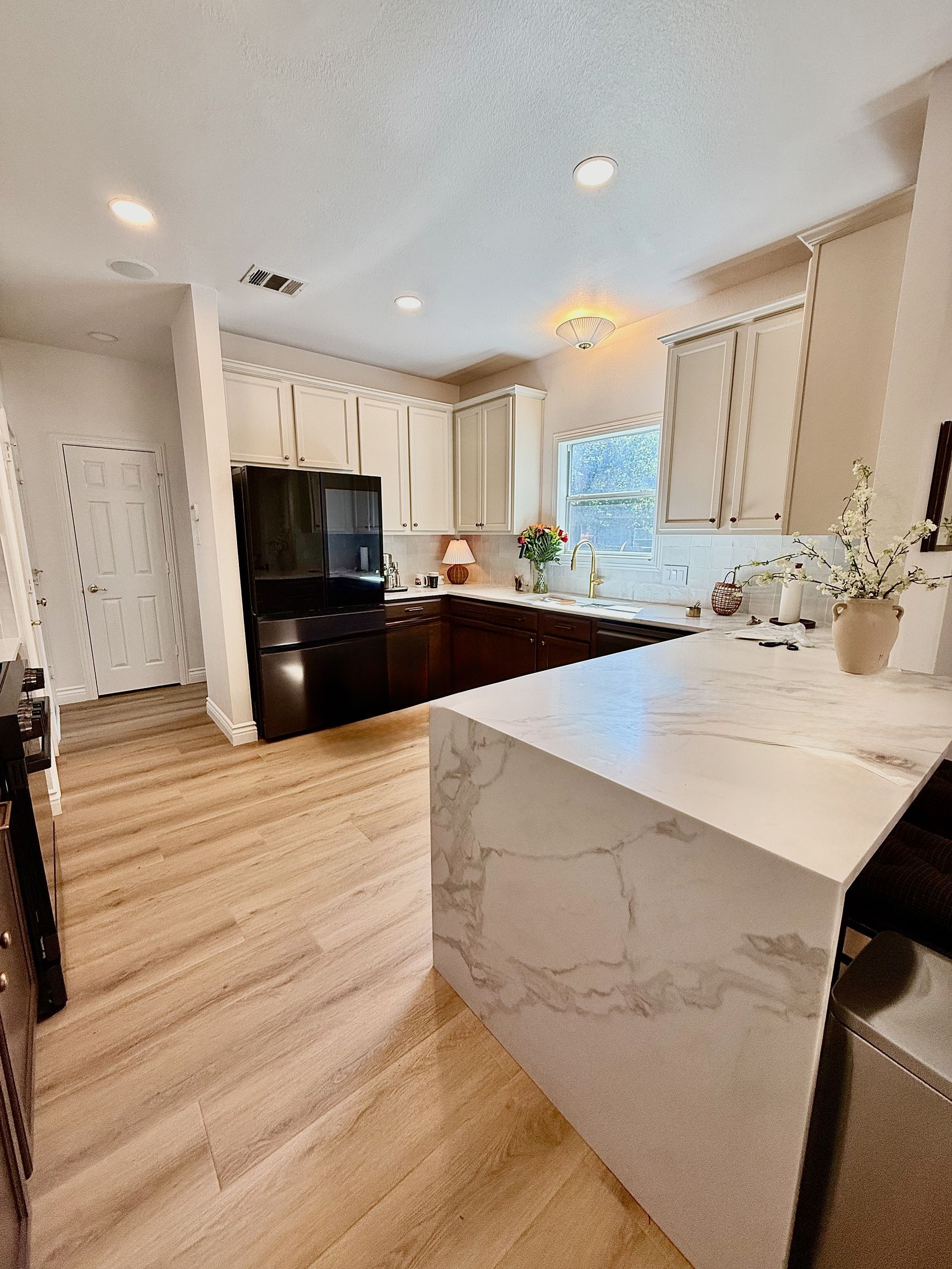 South Austin kitchen remodel with Regal Arabescato Gold quartz countertop with waterfall 