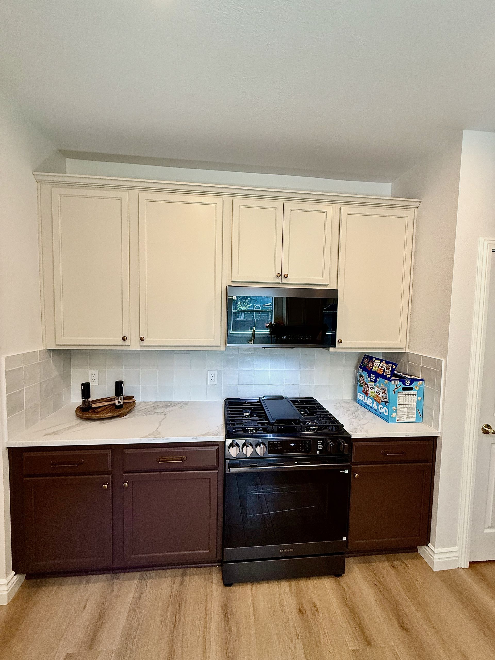 South Austin kitchen remodel with Regal Arabescato Gold quartz countertop with waterfall and Arizona Tile backsplash
