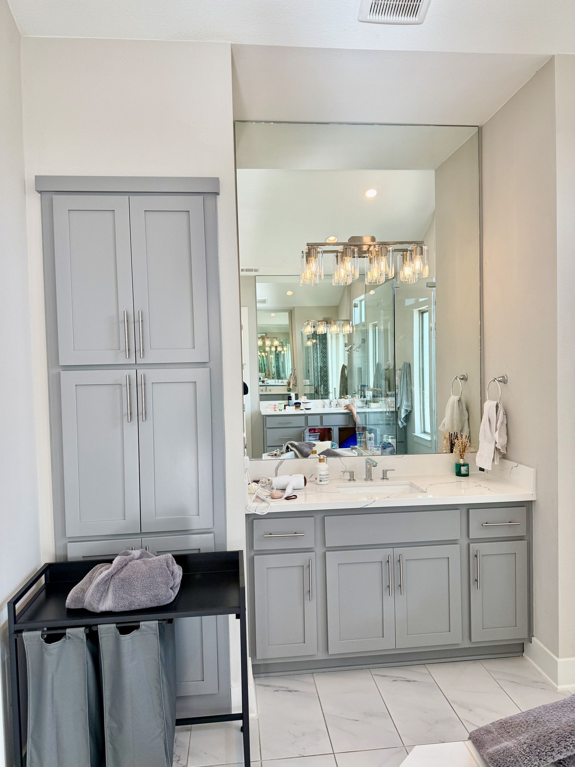 Southwest Austin bathroom remodel with quartz countertops custom mirrors and updated vanity lighting