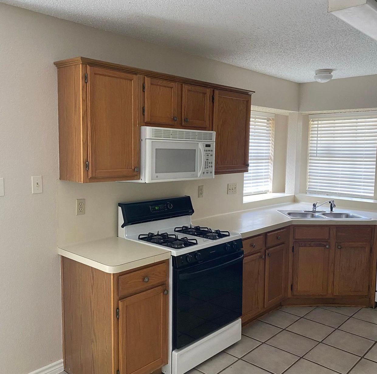 Wells Branch Austin kitchen before remodel with dated cabinets and countertops