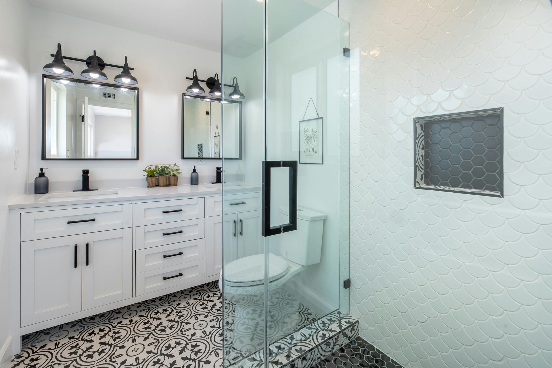 Modern walk-in shower renovation in Austin, TX with custom tile and lighting