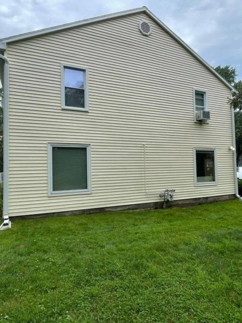 Power washing a house