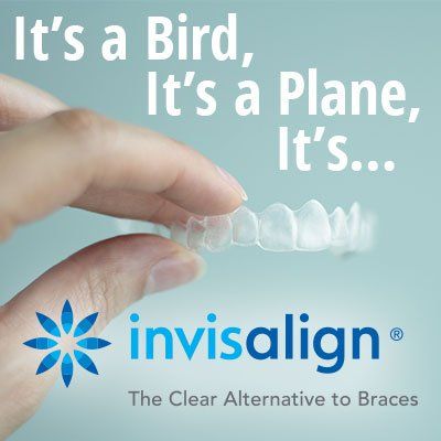 A person is holding an invisalign product in their hand