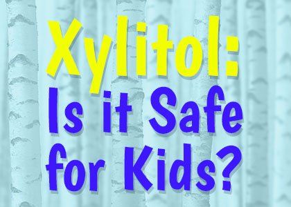 A blue background with the words `` xylitol : is it safe for kids ? ''