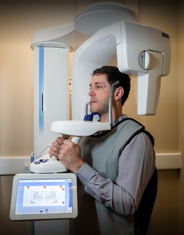 A man is getting an x-ray of his head