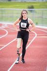 Lindi Marcusen walks the track wearing a running prosthetic