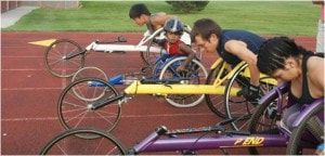 Early ParaSport Spokane wheelchair racing squad lined up on a track