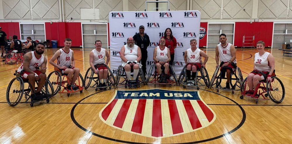 PSS Warriors military team poses at center court on the Team USA logo
