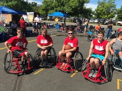 Da Burds team, four players in red shirts, line up at Hoopfest 2018