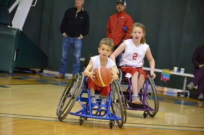 Young player dribbles up court as a teammate in jersey 2 follows