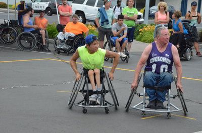 Player in neon yellow faces a player in a purple Cyclones 10 jersey