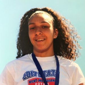 Jaleen Roberts smiles wearing a medal lanyard and a 2017 State shirt