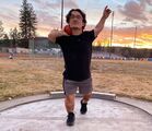 Ben Foos celebrates in the throwing circle at sunset