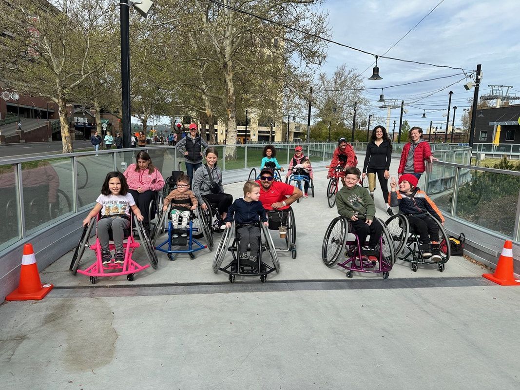 Young athletes in wheelchairs line up at the Future Bloomies start