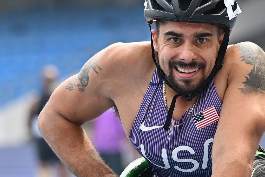 Smiling Team USA wheelchair racer in a helmet, close-up