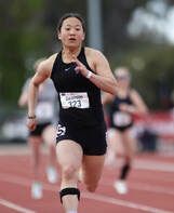 Sprinter in a black uniform races down the track at the US Para nationals