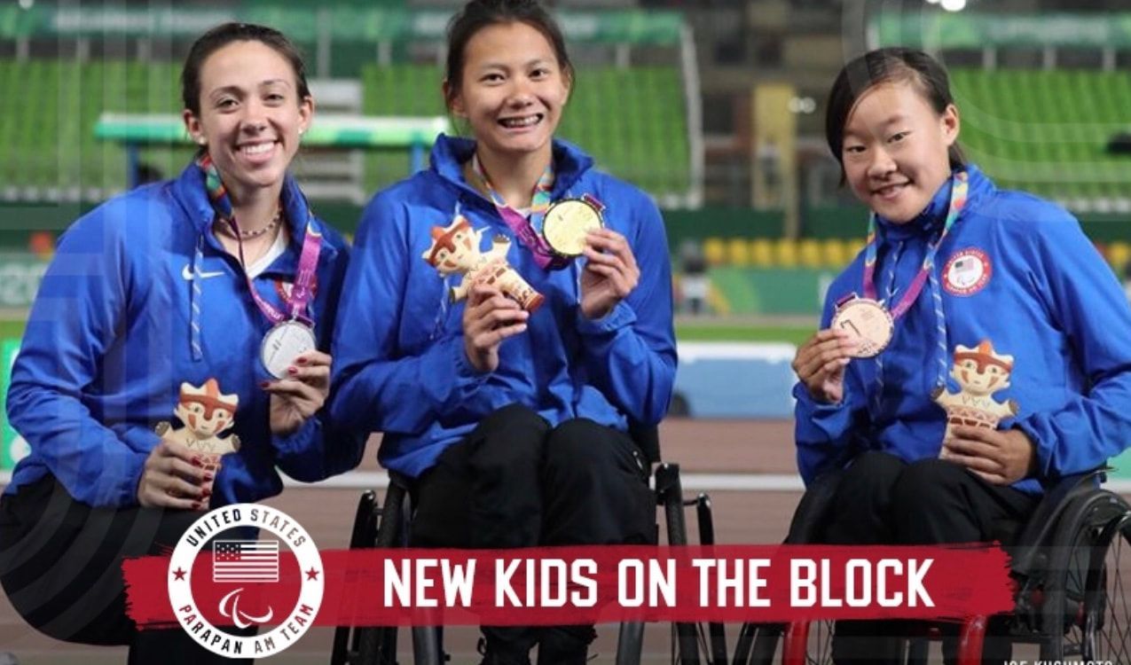 New Kids on the Block graphic, three Team USA racers show T54 400m medals