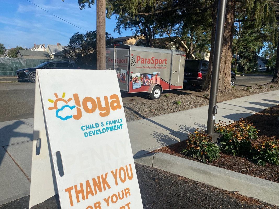 Joya Child and Family Development thank-you sign with the ParaSport trailer