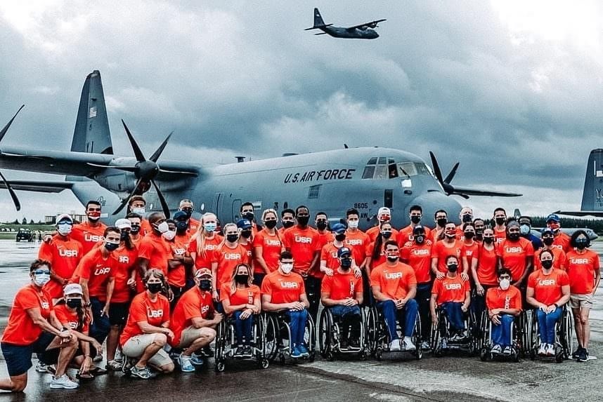 Team USA Track and Field group photo by a US Air Force plane at Yokota