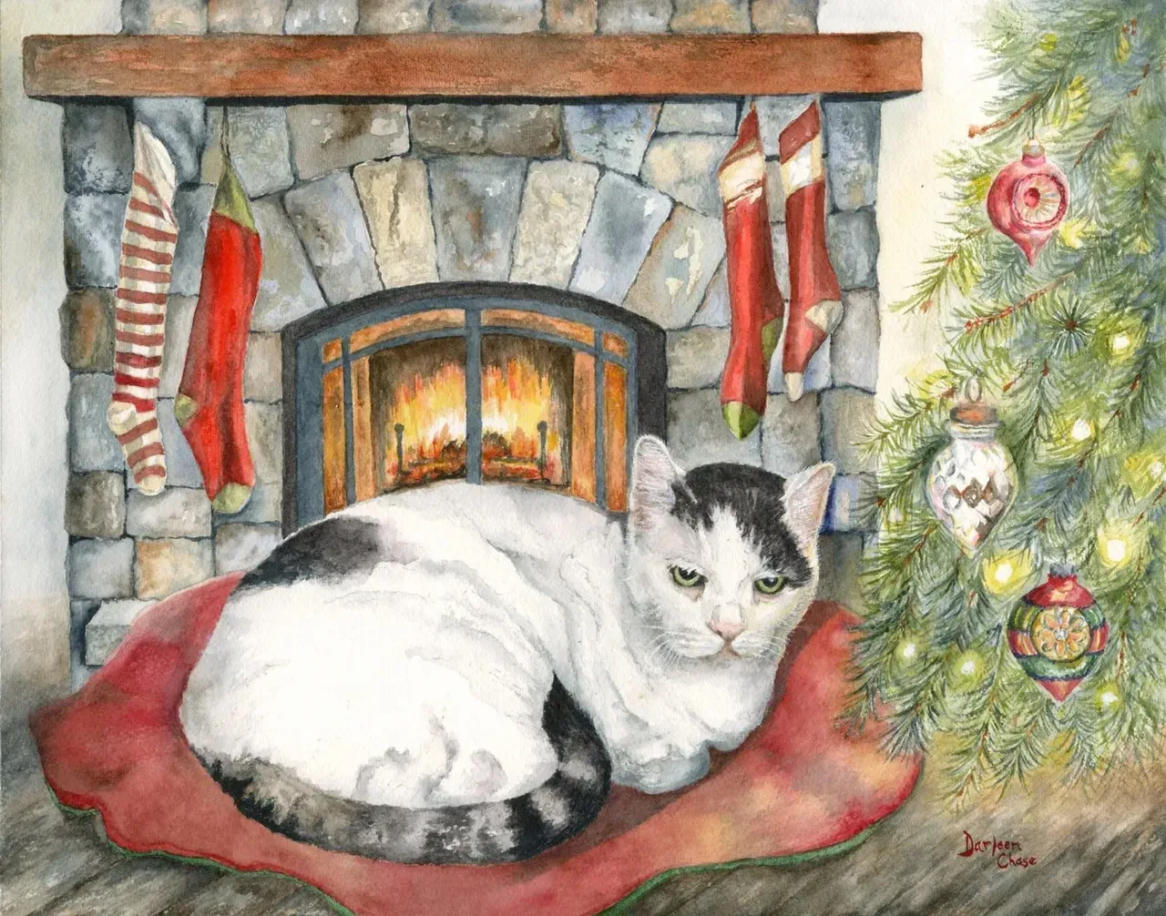 White cat on a red cushion by a glowing fireplace, with a decorated Christmas tree nearby.