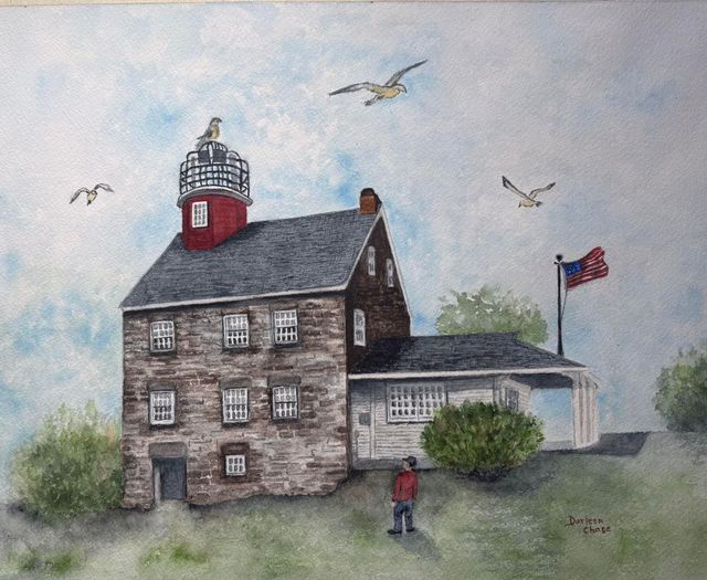 Watercolor lighthouse and stone building by the sea, with birds overhead and a U.S. flag flying.