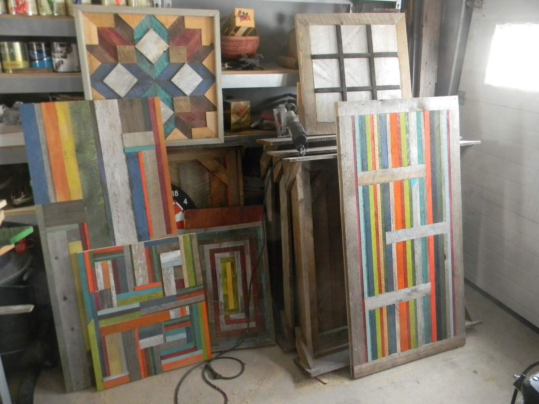 Painted wooden panels with colorful geometric stripe and window designs in a workshop. Woodworking by Ron Archer