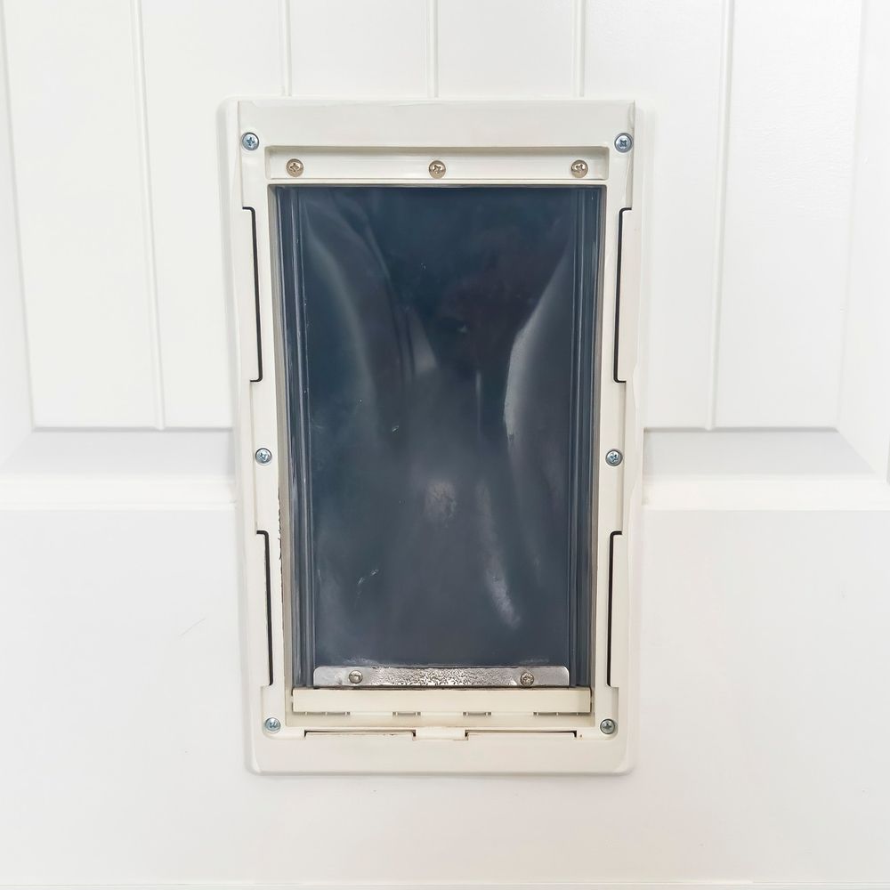 Square Close up of Pet Door or Pet flap — Coastal Screens & Glass in Bonny Hills, NSW