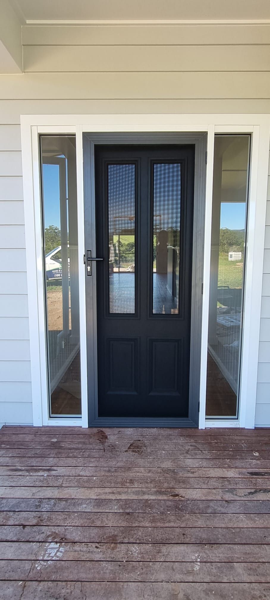 Front Porch Entry With a Black Double Front Door — Coastal Screens & Glass in Port Macquarie, NSW