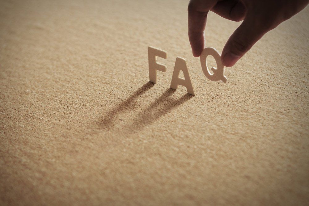 FAQ Word On Compressed Board With Human's Finer At Q Letter — Coastal Screens & Glass in Bonny Hills, NSW