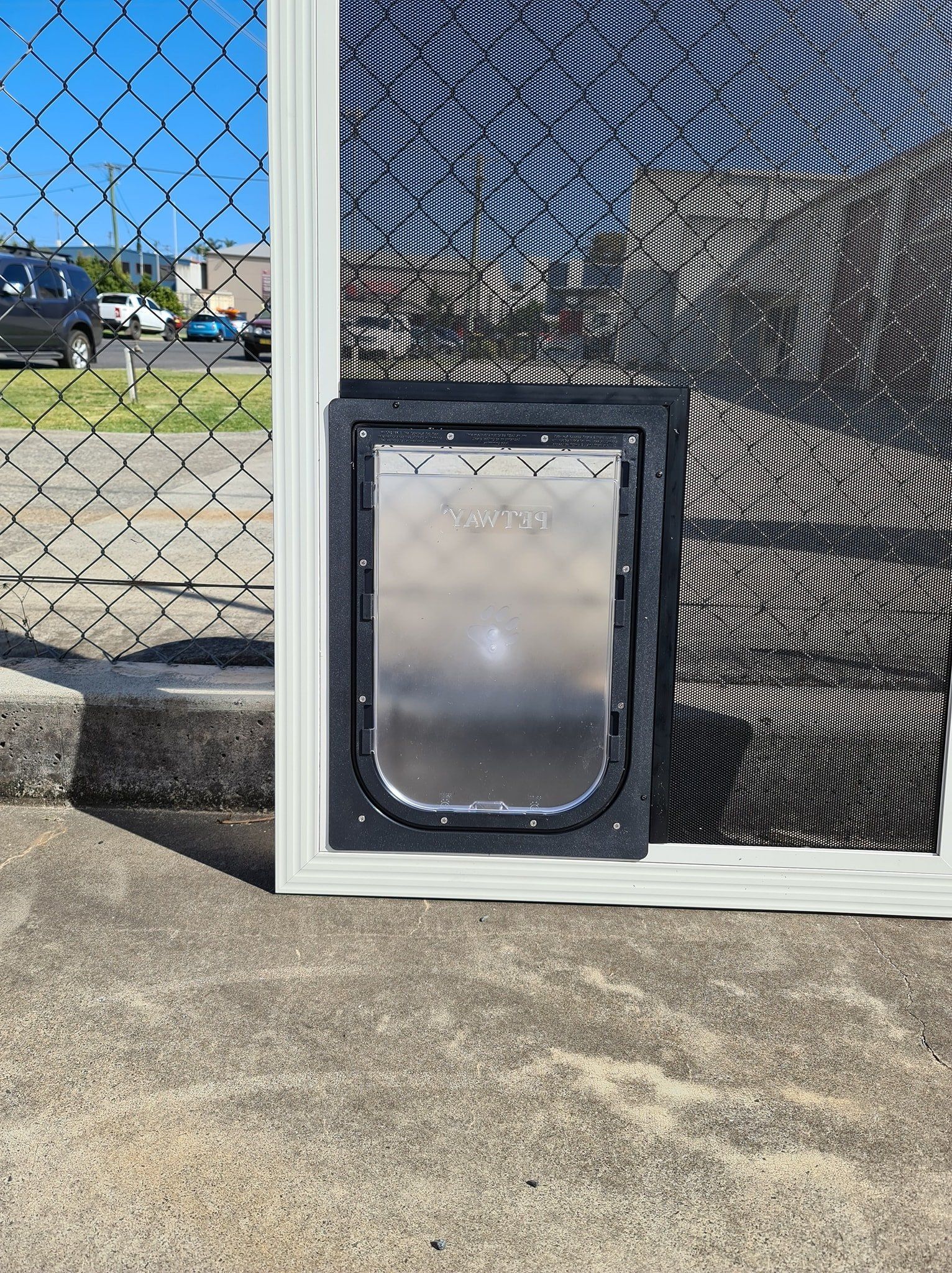 Dog Door In Fly Screen — Coastal Screens & Glass in Port Macquarie, NSW