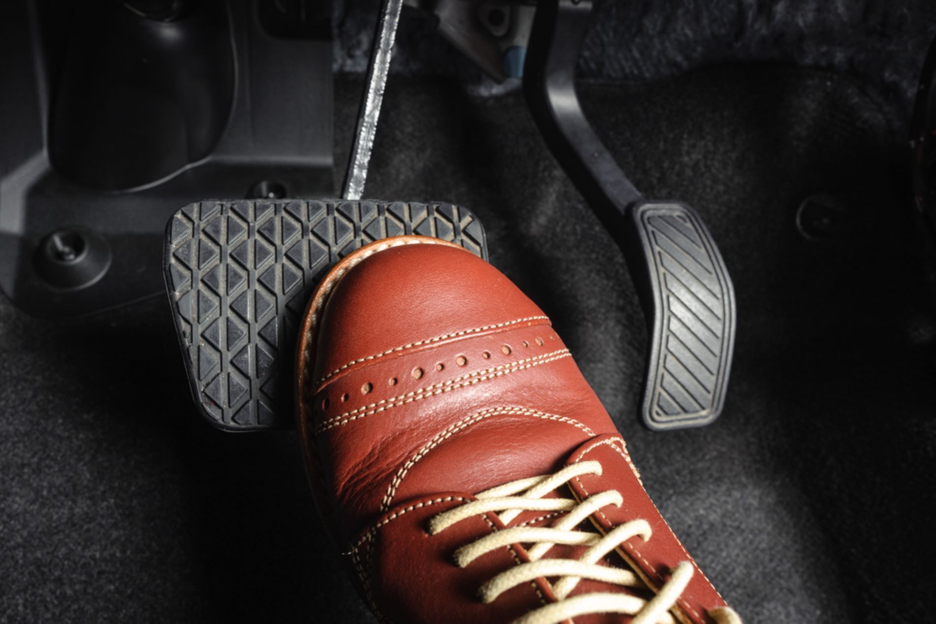 A Person is Pressing the Brake Pedal of a Car — Alstonville Rego & Mechanical in Alstonville, NSW