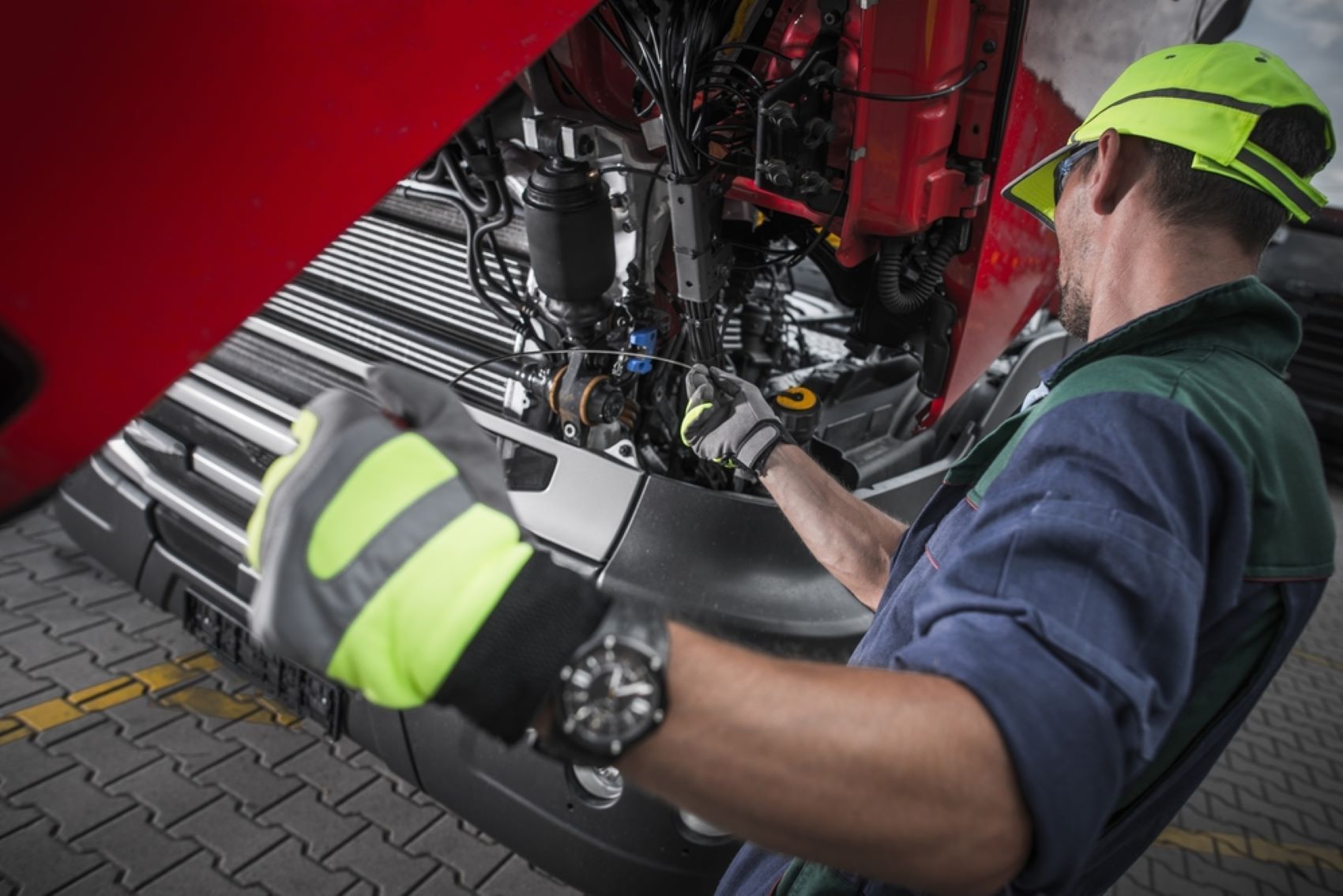 A Man is Working on the Underside of a Truck — Alstonville Rego & Mechanical in Alstonville, NSW