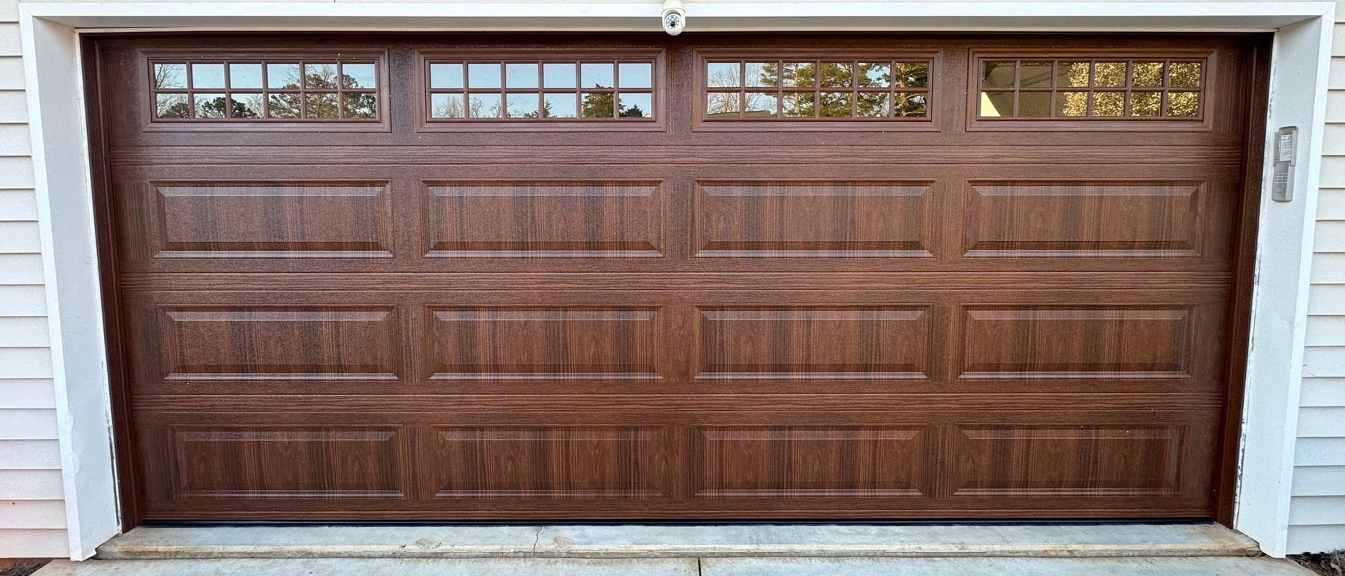 Brown garage door with windows.