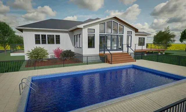Modern white house with a wooden deck and blue swimming pool in the foreground