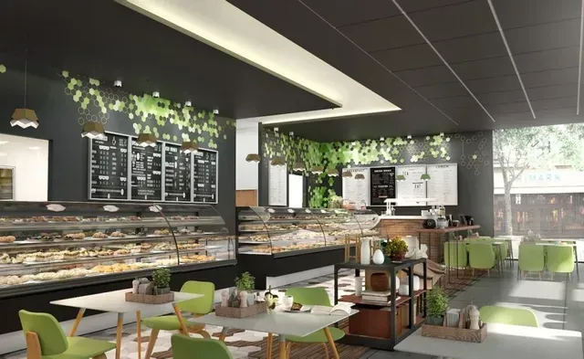 Modern bakery café with pastry displays, green chairs, and indoor plants under bright lighting