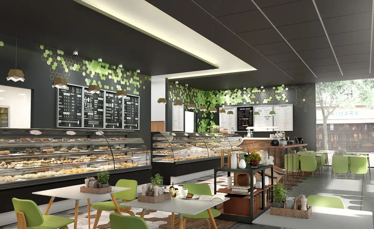 Modern café interior with display counters, green chairs, and hanging plants near large windows