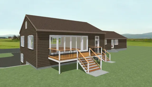 Brown house with a raised deck, stairs, and wheelchair ramp in a grassy yard under a clear sky