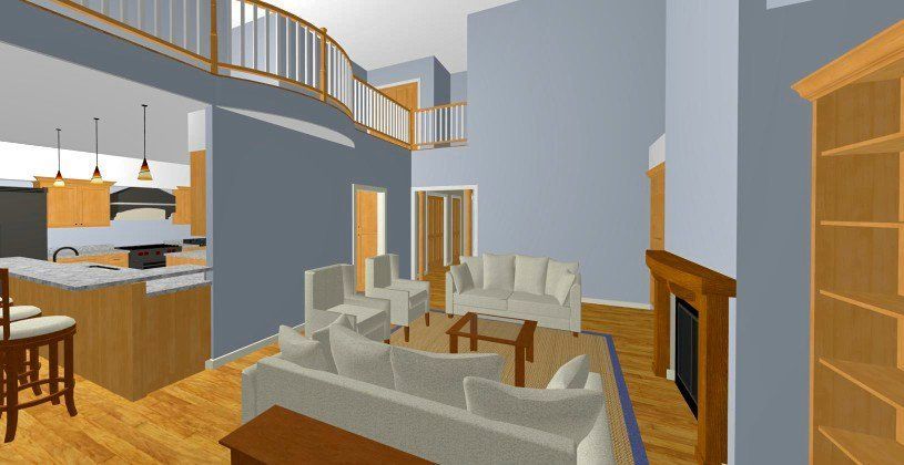 Bright open-concept living room with gray sofas, wooden stairs, fireplace, and kitchen island in the background