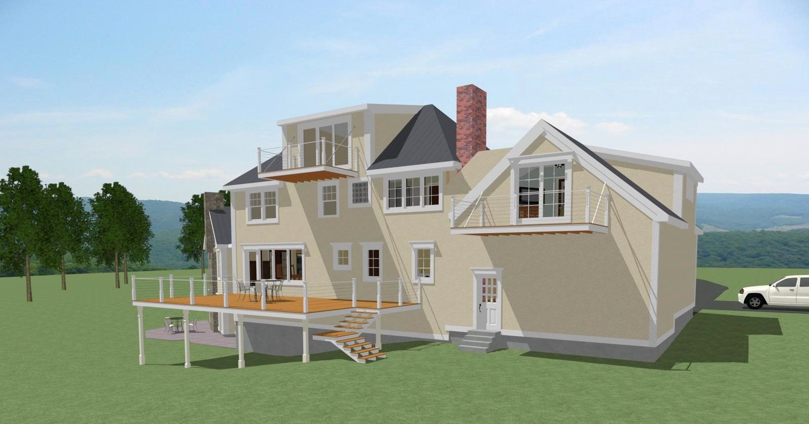 Beige two-story house with a porch and deck on a grassy lot under a clear sky.