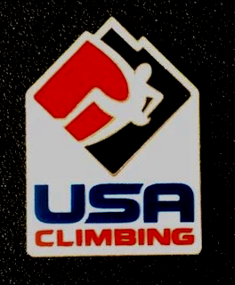 A usa climbing logo with a mountain and a person on it
