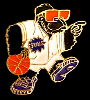 A suns basketball player is wearing sunglasses and holding a basketball