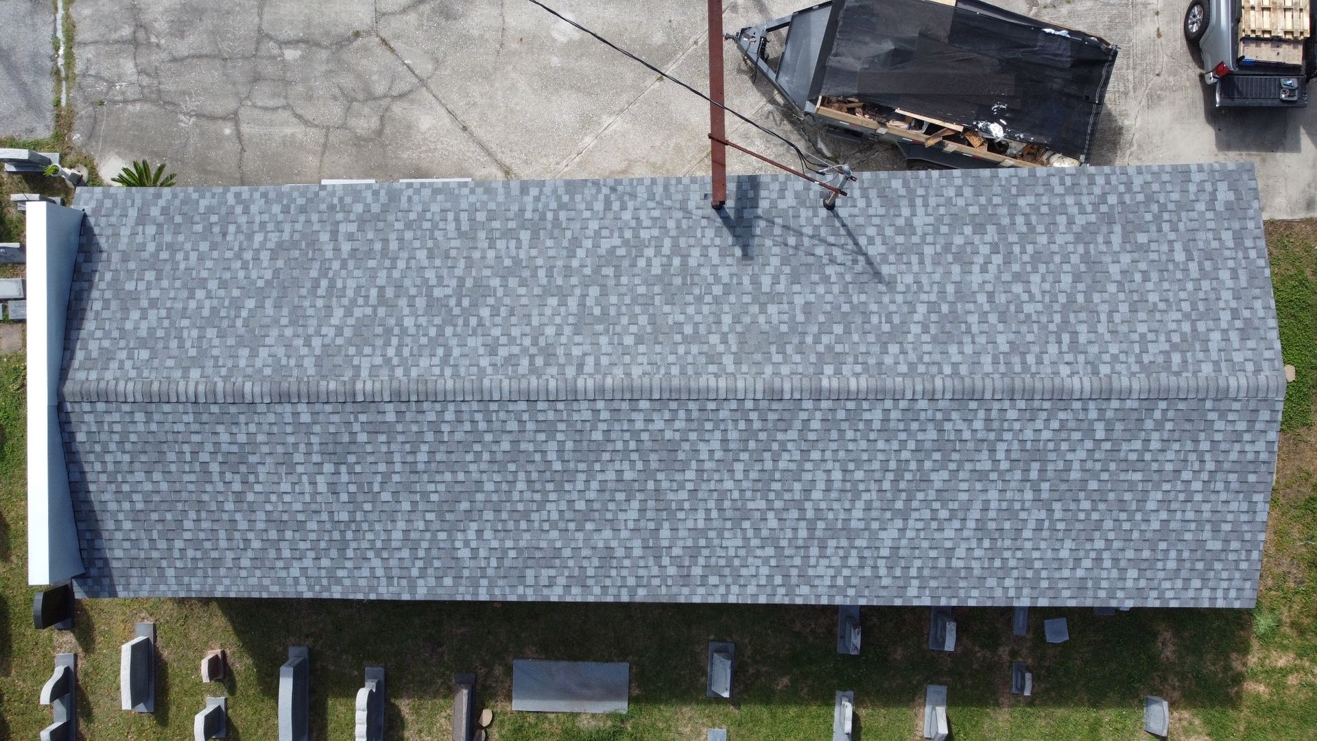 The same roof after replacement with new architectural shingles